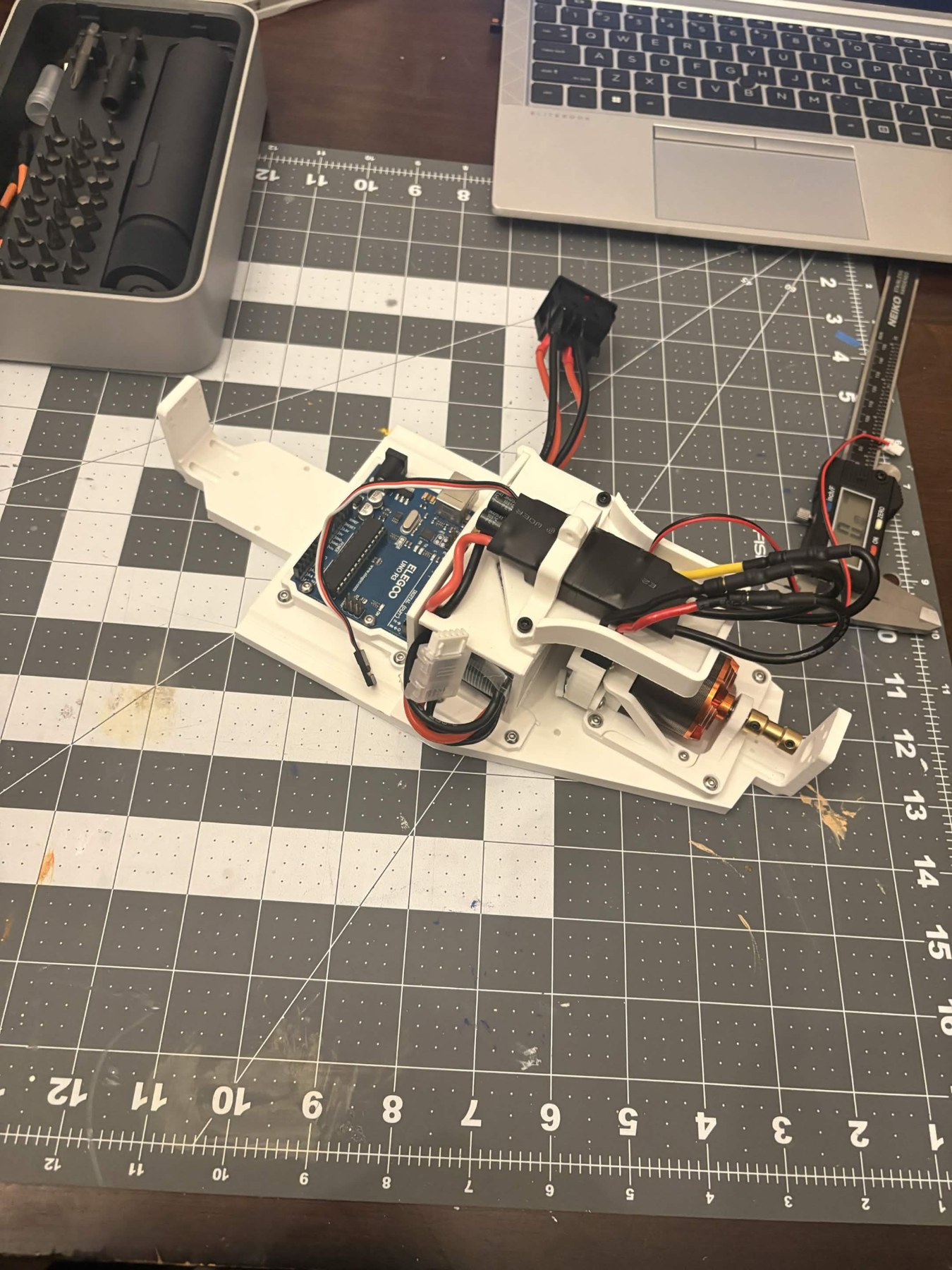 The assembled 3D-printed RC car on a workbench